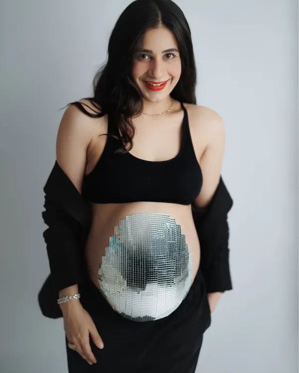 This mama-to-be wanted a session that was both cozy and quirky. Her family even helped create this amazing mirrorball belly. It was a day full of joy and celebrating her journey.