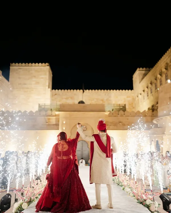 A truly royal varmala at the stunning Suryagarh palace in Jaisalmer. We planned this destination wedding to feel like a modern-day fairytale, complete with fireworks and grandeur.