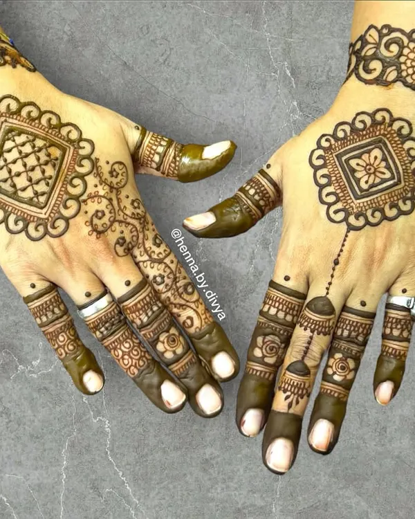This design features a unique square-shaped mandala on the back of the hands. It's a modern twist on the classic circular pattern, perfect for someone looking for something different.