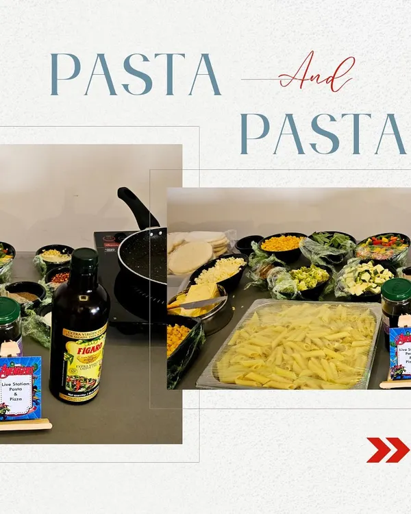 Our live pasta counter shows penne, sauces and vegetable toppings including corn, bell peppers and broccoli, arranged for guest choices.