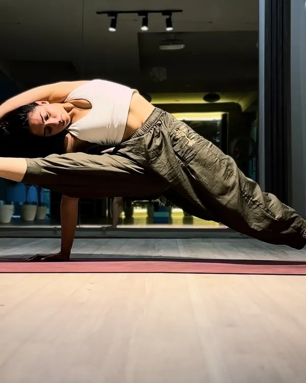 This is what I mean by strength meeting flexibility. My training focuses on building a powerful, controlled body that can create and hold beautiful shapes. It's not just about lifting weights; it's about mastering your own bodyweight.