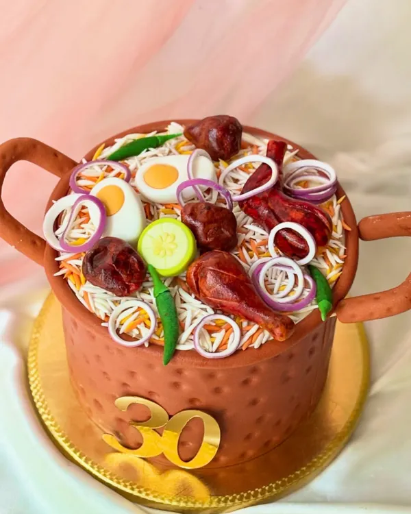This hyper-realistic Biryani pot is actually a cake, perfect for someone who loves food as much as I do. Every detail, from the fondant onions and eggs to the textured pot, is handcrafted to create a memorable centerpiece for a 30th birthday.