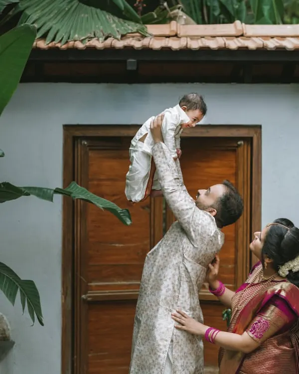 A father's pure joy as he lifts his baby boy towards the sky during his naming ceremony. These are the unscripted, emotional moments I love to capture, creating memories filled with real love and happiness.