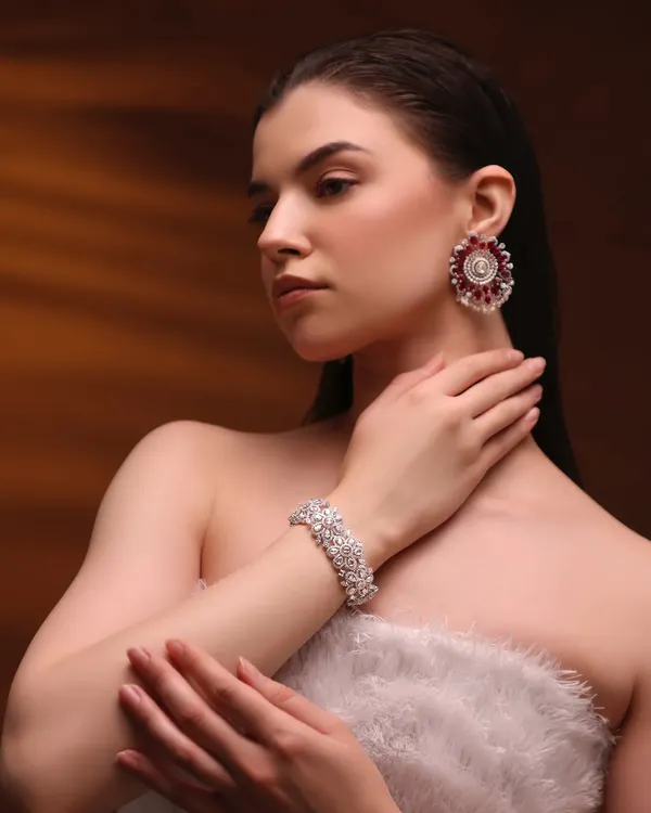 For this high-fashion jewelry shoot, we went with a clean, radiant look to let these stunning ruby and diamond pieces shine. The skin is polished and the makeup is minimal.