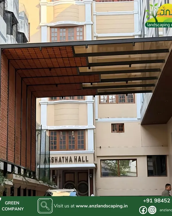 A view of the completed pergola at Akshatha Hall, showing how the structure creates a grand and sheltered entryway that enhances the building's facade.