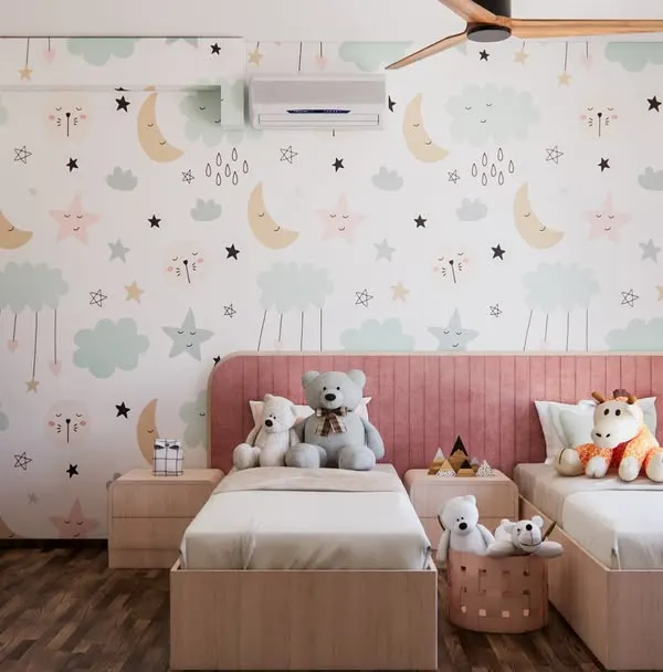 A room full of whimsy and warmth. We designed this space for a sweet little girl, using a dreamy moon-and-stars wallpaper and a soft pink color palette to create a magical haven for play and rest.