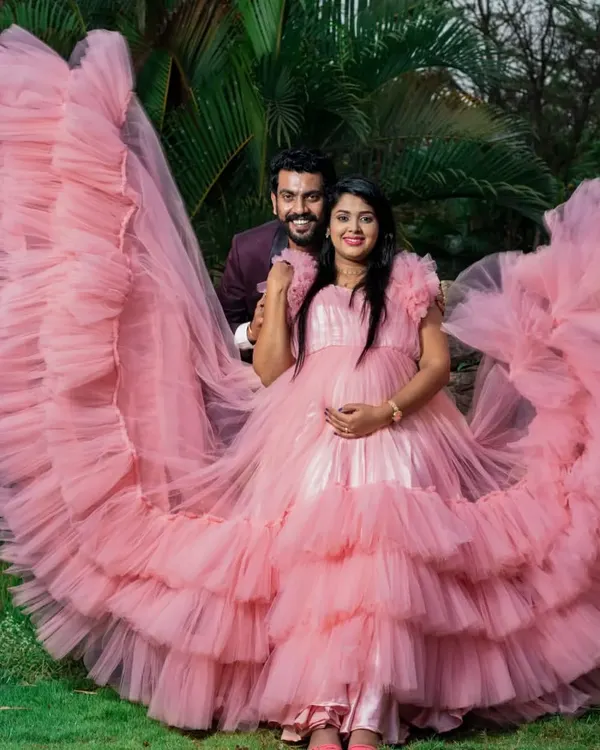 Celebrate your journey to motherhood with our special collection of maternity photoshoot gowns. This dramatic pink ruffled gown is designed for comfort and style, ensuring you get those breathtaking shots.
