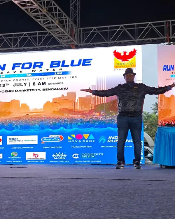 On stage at the "Run for Blue" marathon in Phoenix Marketcity. My setup includes a large LED screen for event branding and a sound system to energize thousands of runners.