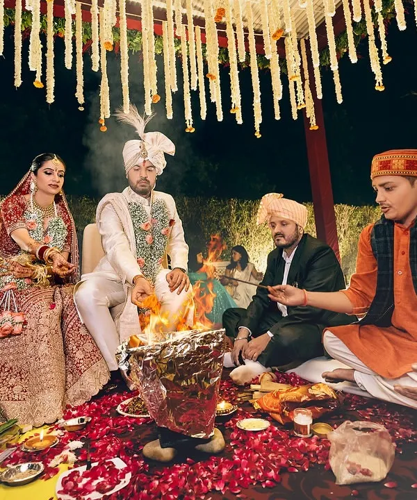 Bound by sacred vows, their journey as one begins amidst the holy flames of the havan kund. A traditional Pahadi wedding ceremony.