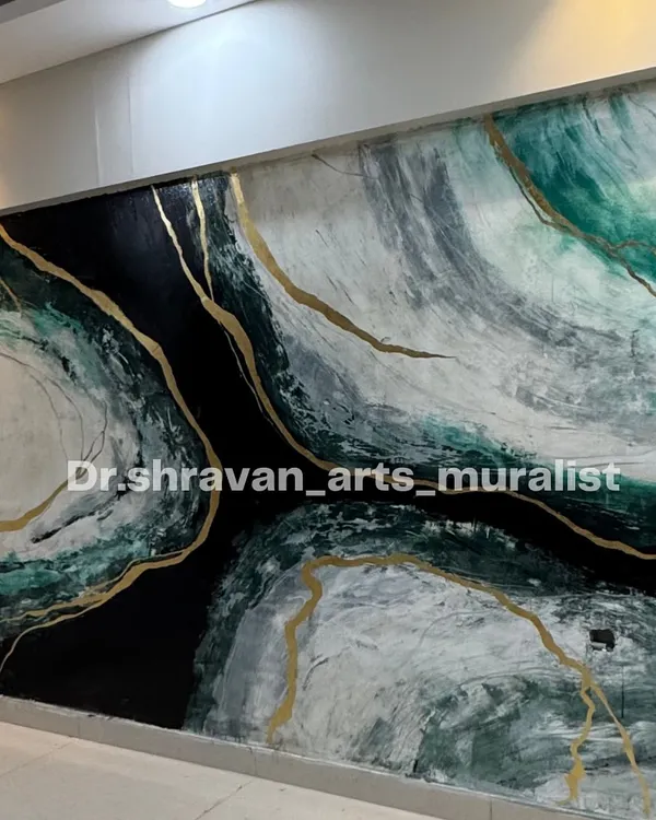 This large-scale granite mural features dramatic swirls of black, white, and green, shot through with veins of gold. It's a powerful statement piece that brings energy and luxury to the wall.