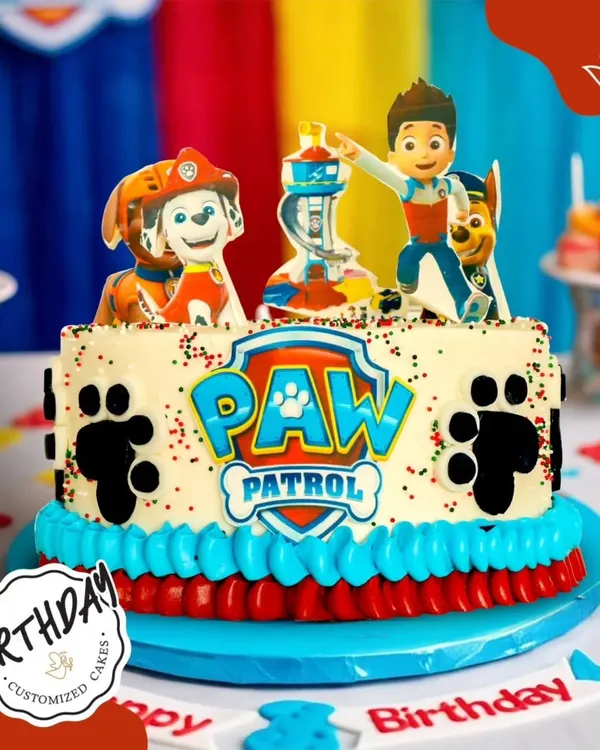 Paw Patrol is on a roll! This fun cake features Ryder and his team of pups, complete with paw prints and the iconic logo, ready for a birthday rescue mission.