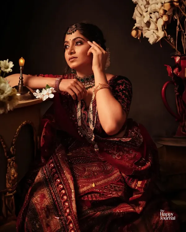 This portrait captures the grace and depth of an artist. I used dramatic, low-key lighting to create a vintage, painterly feel, highlighting the intricate details of the traditional attire and the thoughtful expression. This is an example of a creative branding portrait for actors and performers.