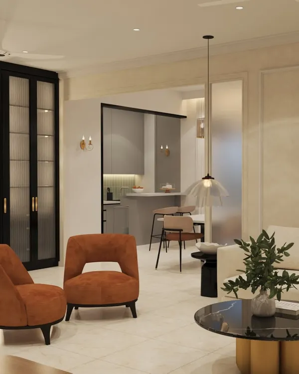 A proposed design for "The Beige House," a 3BHK flat in Basavanagudi. This view shows the living area with burnt orange accent chairs and a clear glass partition offering a glimpse into the kitchen, creating a sense of open, connected living.