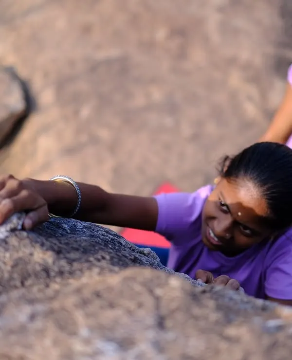 A close-up of one of the local girls from Hanumanhalli trying climbing for the first time. Her focus and determination are inspiring.