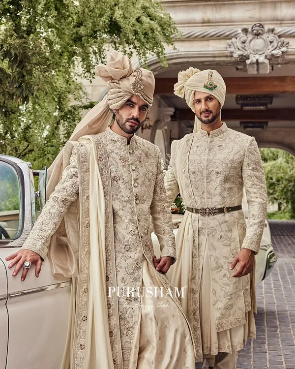 The groom and his groomsman, dressed in my impeccable tailoring. I designed these coordinated ivory sherwanis to reflect a blend of style, brotherhood, and timeless charm.