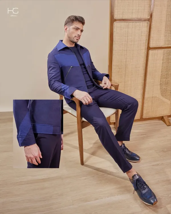 This stylized overshirt set in a deep navy blurs the lines between refined and relaxed. It's an example of a complete, tailored look that is perfect for dinners, after-parties, or your next getaway, designed to move with you.
