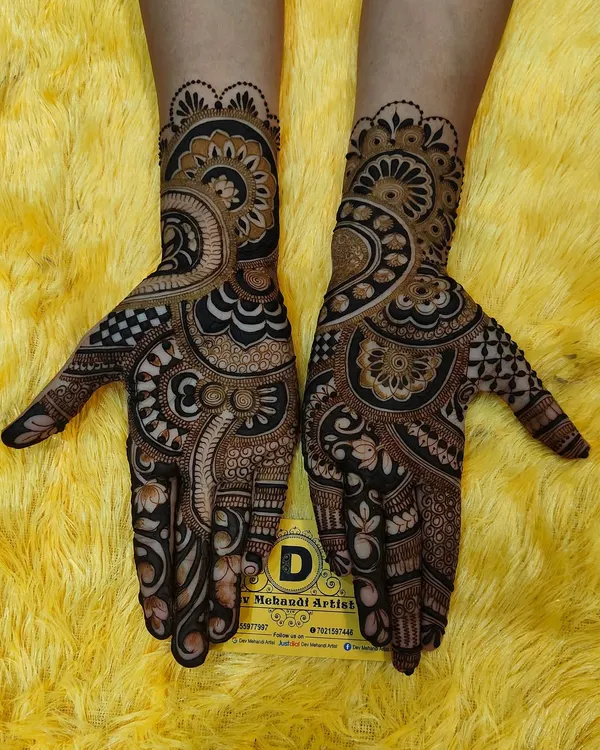 A beautiful example of a bold Arabic fusion design. This style is characterized by thick outlines, detailed shading, and open spaces, creating a very striking look.