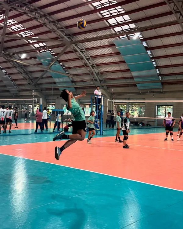 A Mintonette+ player demonstrates peak form with a powerful jump spike during a competitive match at an IIT Mumbai tournament. This is the level of performance our training aims to achieve.