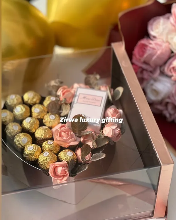 Celebrate love with elegance. This newly launched luxury Valentine's hamper features a heart-shaped box of Ferrero Rocher chocolates and Miss Dior perfume, all encased in a stunning rose gold acrylic box.