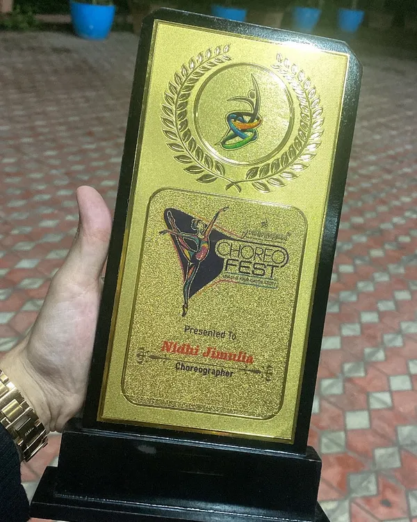 A close up of my Choreographer Achievement Award from Choreofeast. This trophy is a symbol of my expertise and recognition within the dance industry.