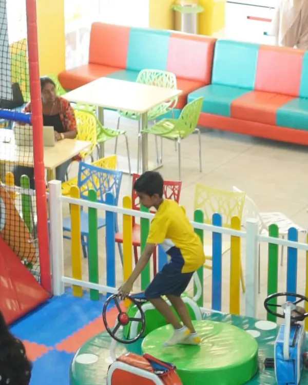 Our colorful and comfortable cafe seating area. It's the perfect spot to unwind while still keeping a close eye on the kids.
