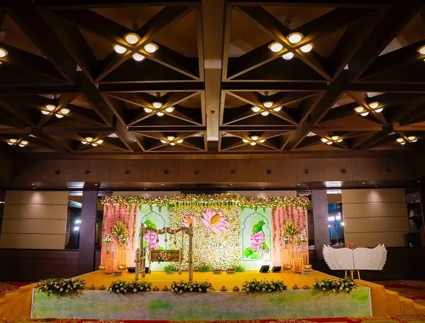I believe every milestone deserves a grand celebration. For this naming ceremony, I designed a breathtaking 'Lotus Love' stage, combining a wall of fresh white flowers with elegant lotus motifs and a traditional cradle, creating a serene and memorable setting for the family.