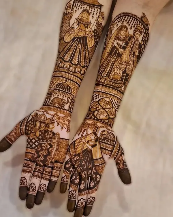This is what I mean when I say your mehndi should tell your story. This full bridal design captures the bride's journey, with detailed figures of the doli ceremony, varmala, and the couple's portraits. Every element is drawn with care to make it a masterpiece you'll cherish forever.