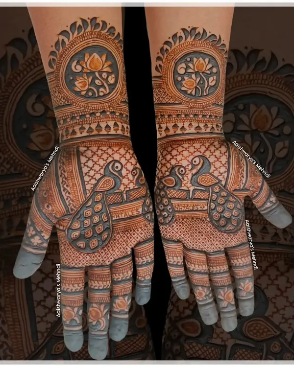 A classic design featuring two peacocks on each palm, surrounded by a delicate net pattern. The wrists are adorned with a lotus mandala.
