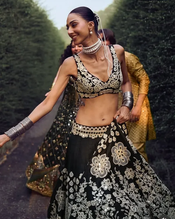 A pearl-draped bun seen from the front, created for a campaign with designer Abhinav Mishra. The delicate pearls add a touch of royalty to the traditional ethnic wear.