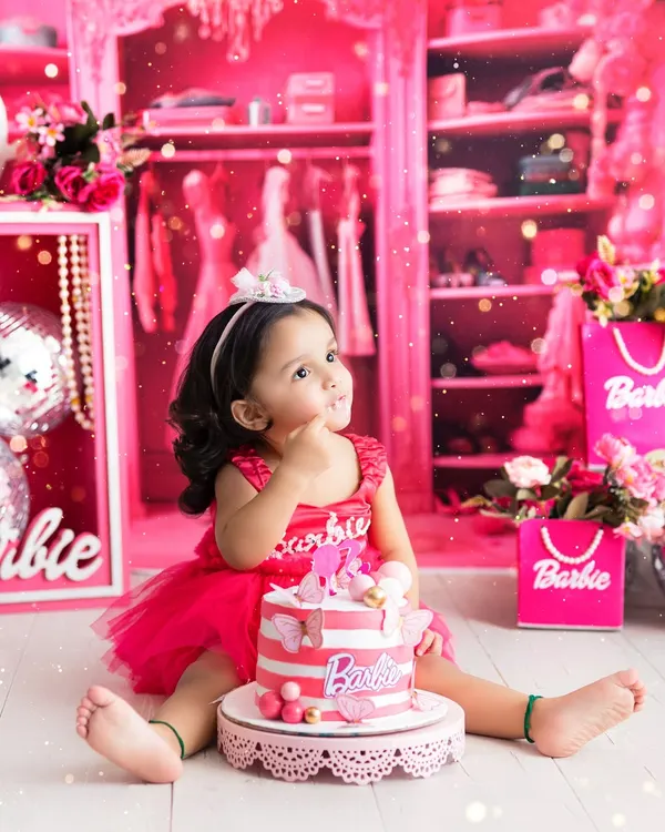 Welcome to the Barbie dream world! This vibrant, all-pink cake smash session is perfect for your little fashionista, complete with a themed cake and a closet full of dreams.