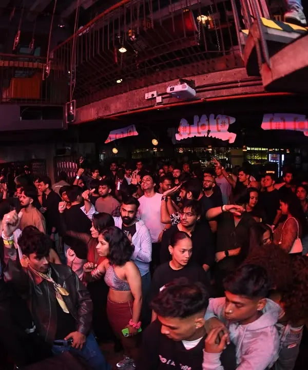 A wide shot of the packed house at The Grind. Every Saturday, Khar Social turns into a family reunion for hip-hop heads.