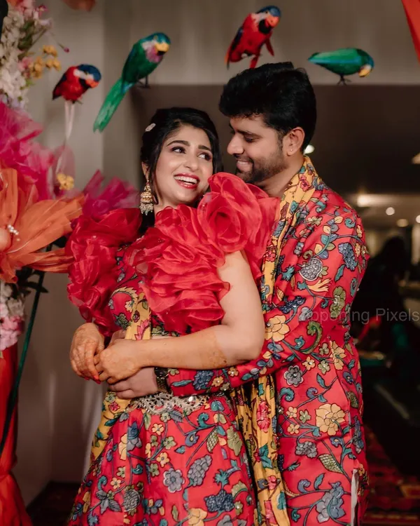 The happy couple, Aditi and Yashas, at their vibrant Mehendi ceremony. We used a riot of colors, with custom parrot props and a backdrop full of tassels and flowers.