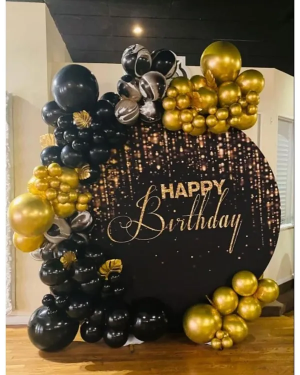 A chic and elegant black and gold circular backdrop with a 'Happy Birthday' sign, perfect for a sophisticated celebration.