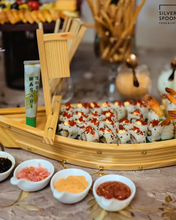Our signature sushi boat, filled with an assortment of fresh, handcrafted sushi rolls. This impressive centerpiece is perfect for birthdays, corporate events, and any special celebration.