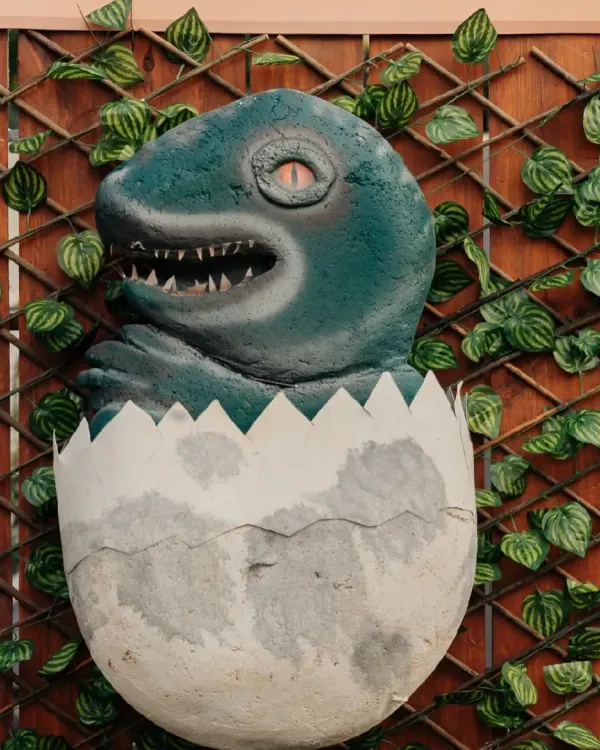 Welcome to the land of dinosaurs! This hatching dinosaur egg prop was a huge hit at our Jurassic Park-themed party, adding a touch of thrilling realism.