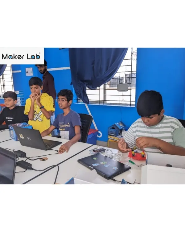 A typical day in our Maker Lab, where students are deeply engaged in building their projects. Here, they are working with our robotics kits, learning through hands-on tinkering and problem-solving.