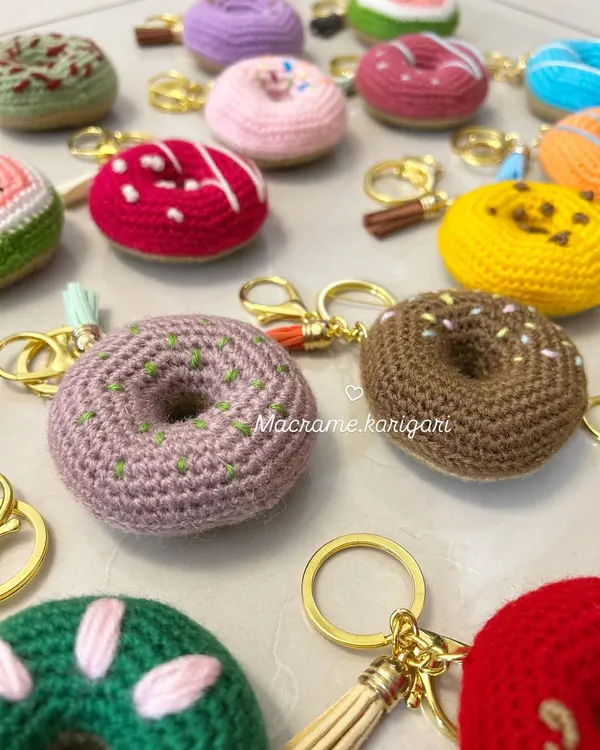 A sprinkle of sweetness for your keys. Our donut crochet keychains come in various "flavors" with different colored icing and sprinkles. They are a fun, calorie-free treat for any donut lover.