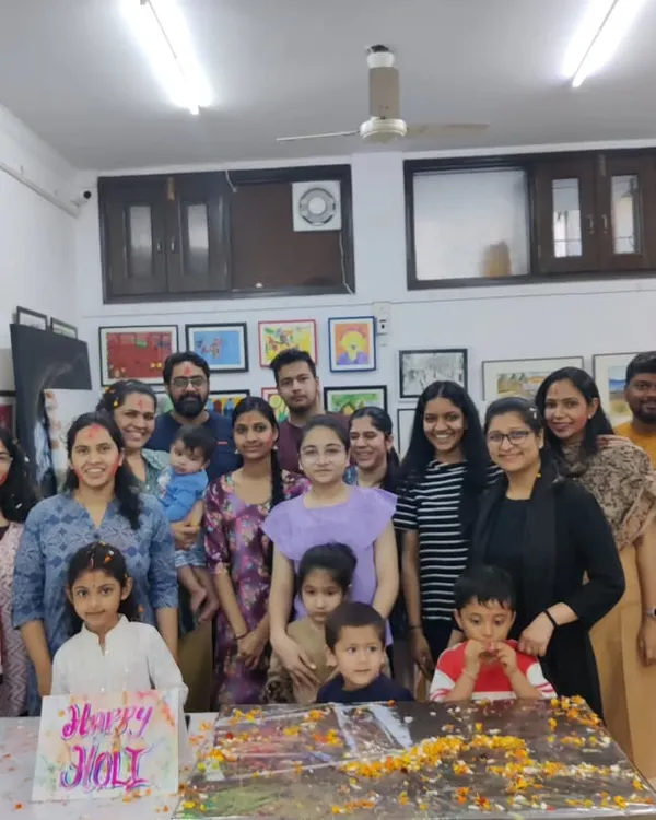 A group photo of our students and instructors celebrating Holi at the studio. We believe in fostering a joyful community alongside artistic growth.