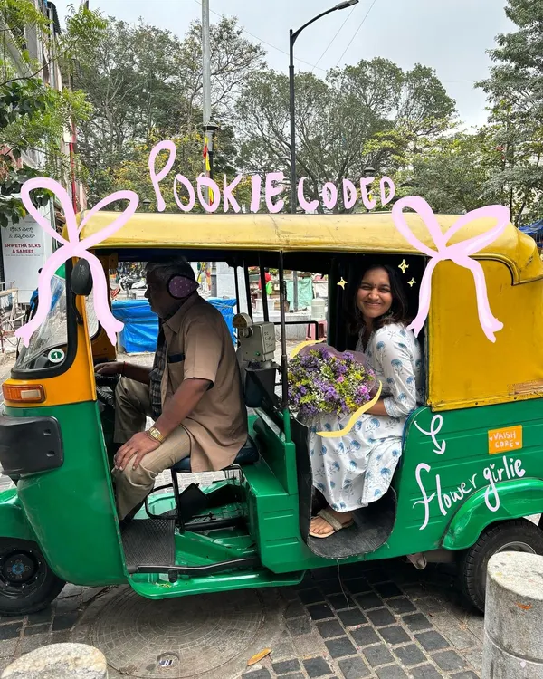 Pookie coded. A cute moment in a classic Bengaluru auto-rickshaw, made even better with some flower-girl doodles.