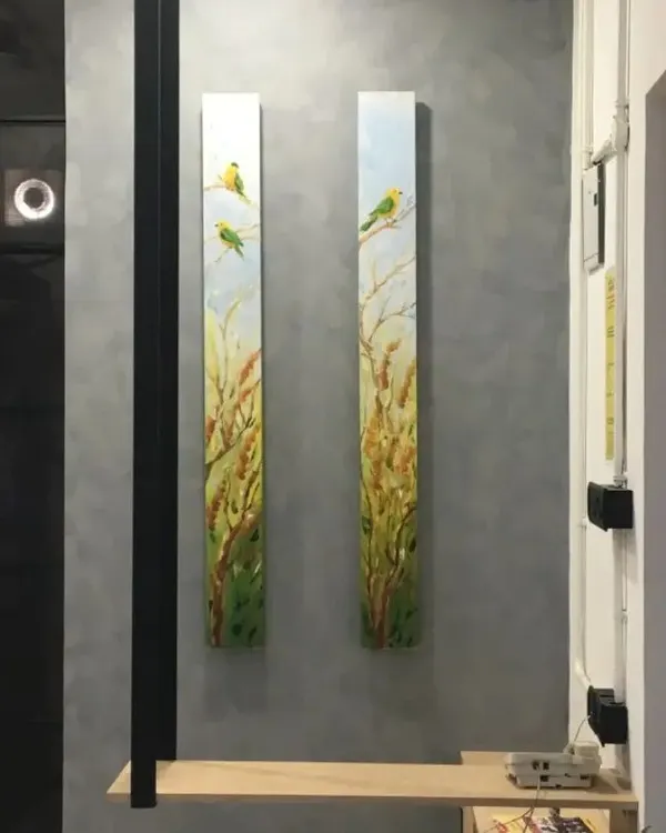 This is the finished look for our office pillar project. We installed two vertical canvas paintings featuring birds in a wheat field, which complements the new grey textured wall finish.