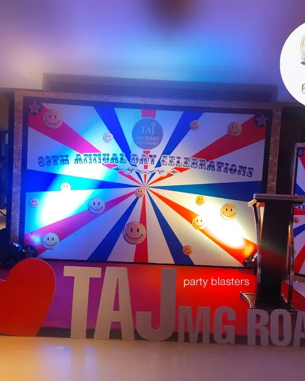 We design and execute bold stage setups for major corporate events, like this one for the Taj MG Road's annual day celebration. The design features large, custom 3D lettering and a vibrant, branded backdrop to create a high-energy focal point for the festivities.