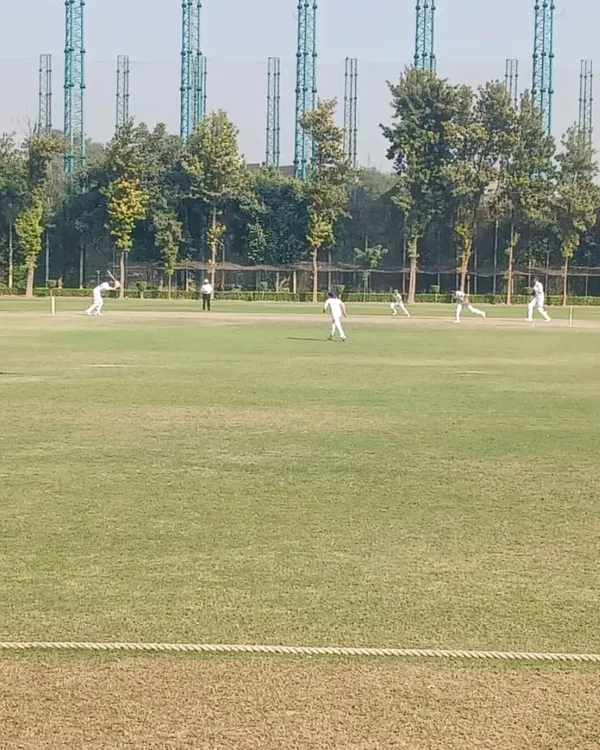 A wide view of a competitive match in progress at our grounds. We provide a professional playing environment to simulate the experience of high-level cricket tournaments.