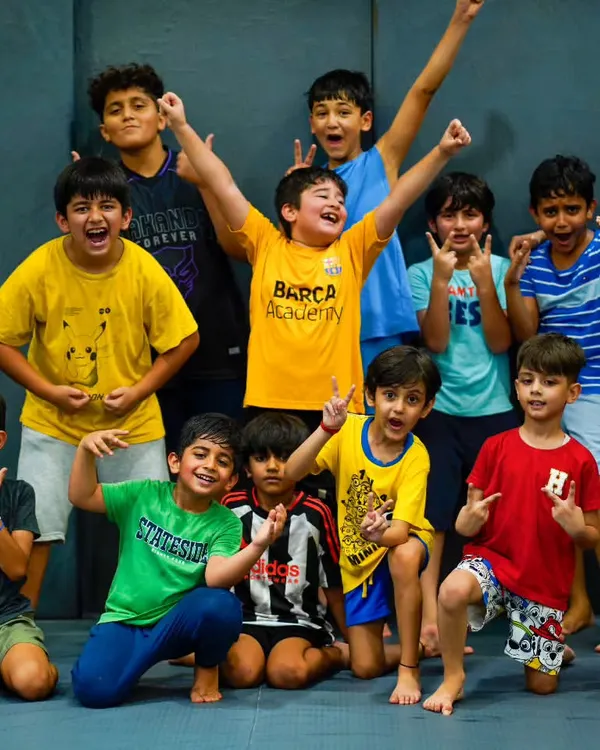 This is the spirit of Warrior's Cove. A group of our Little Warriors, full of energy and confidence after a great training session with their coach.