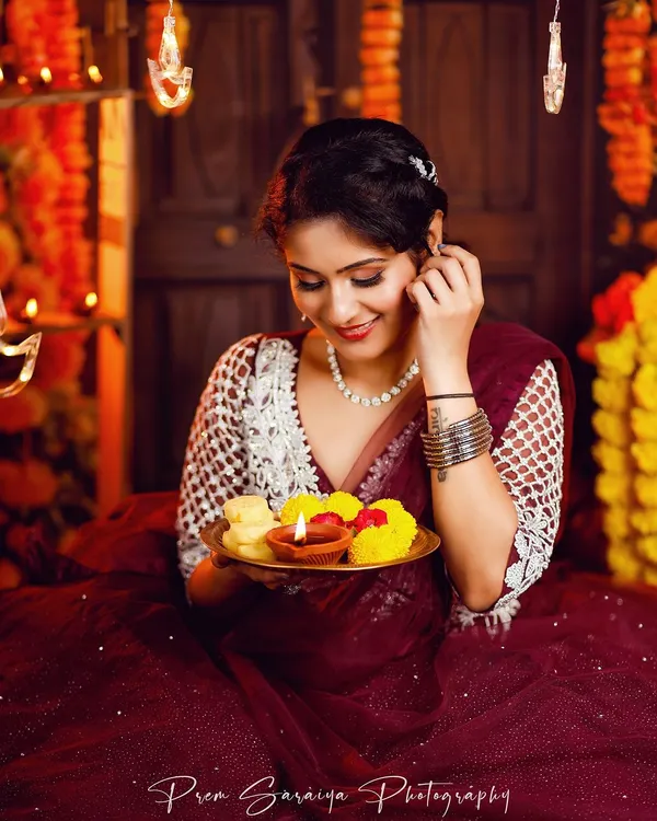 A candid moment from our Diwali themed shoot. The makeup features a soft smokey eye and a warm, glowing base, perfect for the festival of lights.
