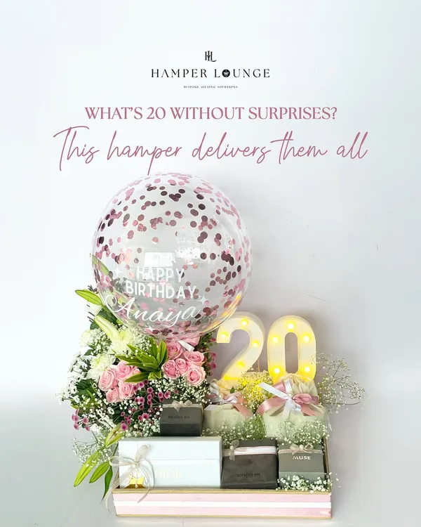 Turning 20 is a big deal, and this hamper was designed to capture all that excitement. It features a light-up "20", a personalized confetti balloon for Anaya, fresh pink roses, and boxes of curated surprises to start her new decade in style.
