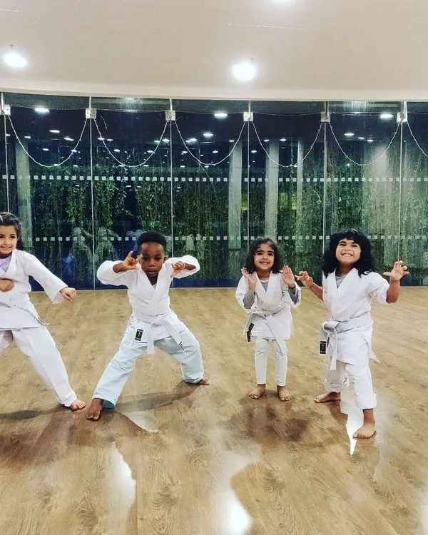 Say hello to some of my four-year-old warriors. In our indoor studio, I encourage them to be expressive and find their own powerful poses. This is beginner karate for preschoolers, where fun comes first.