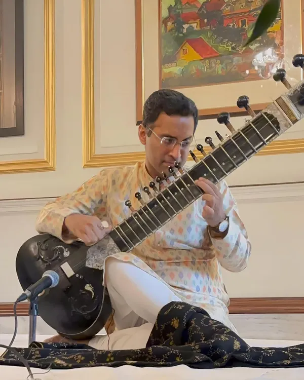 Performing at a private 'Baithak' style house concert. This intimate setting allows for a deep connection with the audience and a truly personal musical journey.