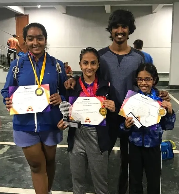 A group of our successful players with their coach after a great performance. We celebrate wins in the U12 and U14 girls categories, a result of teamwork between players, parents, and coaches.