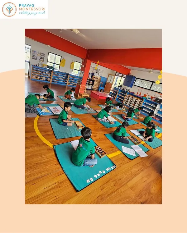 This is the beautiful result of a prepared environment. Children working independently, respecting each other's space, and fully absorbed in their tasks. This is success in a Montessori classroom.