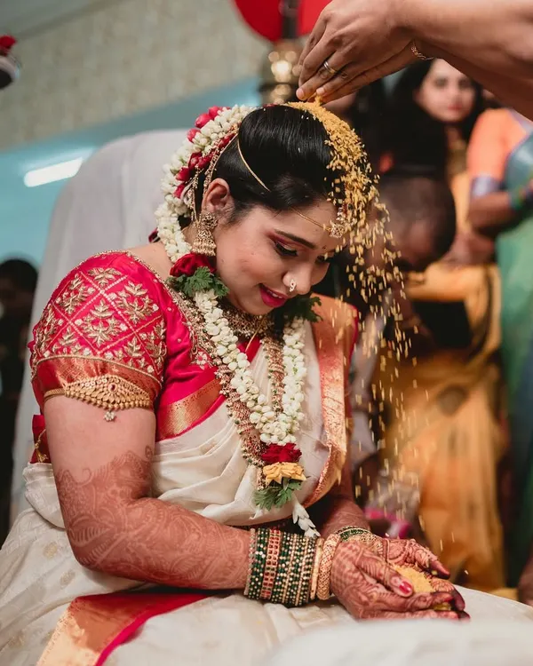 This is the heart of a South Indian wedding. For this Muhurtham look, I focused on creating a radiant, flawless base that glows under the lights, paired with classic eye makeup and a hair arrangement adorned with fresh flowers to honor the sanctity of the moment.